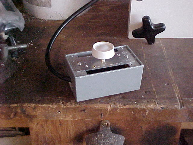 a light dimmer in a pullbox for controlled current to the wire.jpg